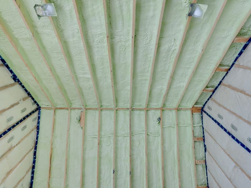Spray foam insulation applied to wall cavities in a new build